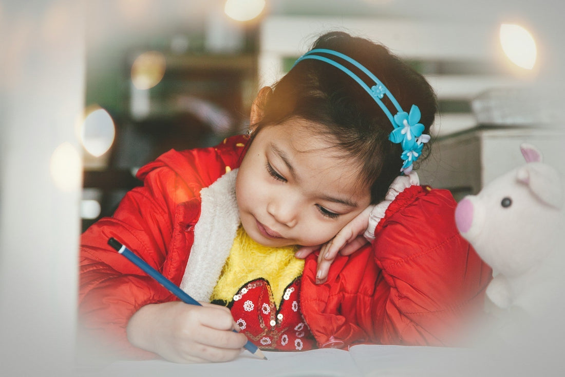 young girl practicing handwriting