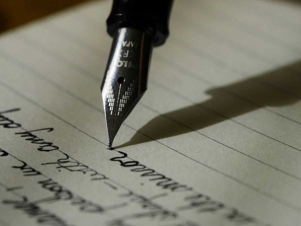 Cursive writing with a black pen