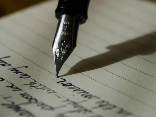 Cursive writing with a black pen