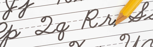 Pencil tracing letters to learn how to write in cursive