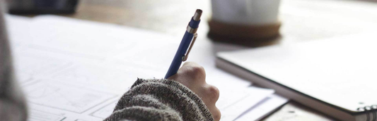 student practicing handwriting in a workbook