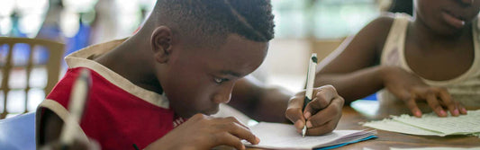 Students practicing writing letters